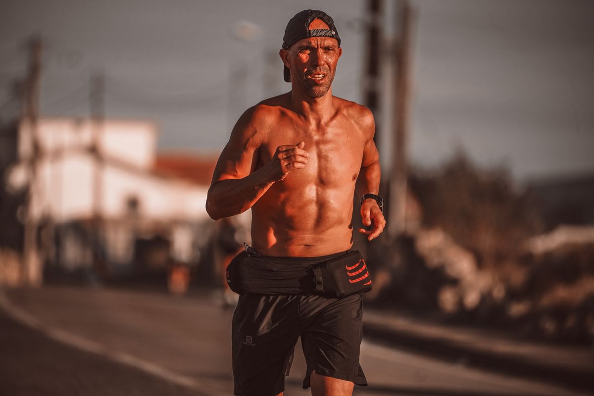 Man running outdoors at sunrise